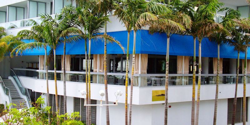 commercial-awning-restaurant-with-protective-drape-curtains-miami-awning